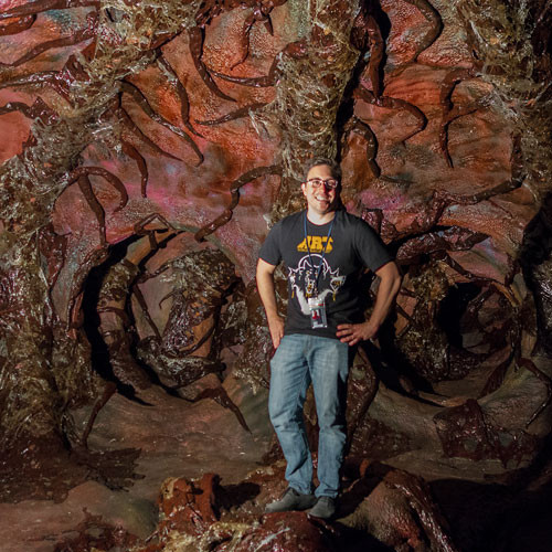 Rob Nagy, Stranger Things Set Designer in front of a spray foam tunnel on the set